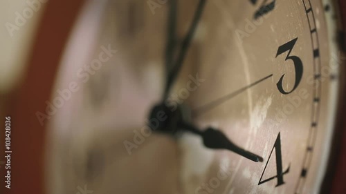 Close up of a wall clock face.