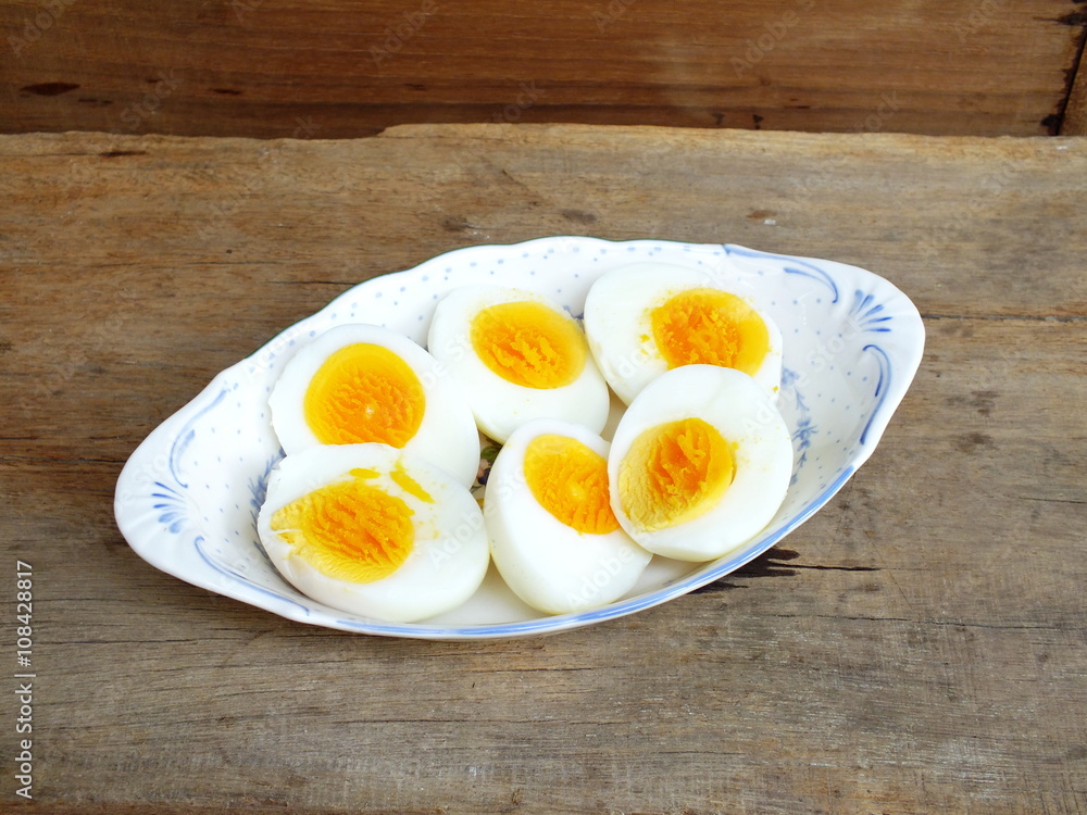 boiled eggs on plate and wooden background close up boiled eggs on plate and wooden background close up