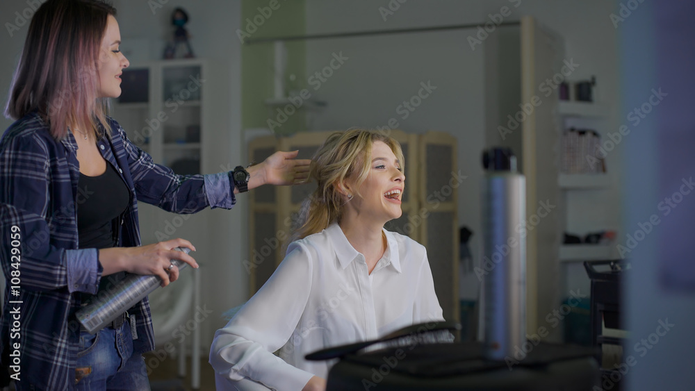 Emotional blonde looks in the mirror and talking with your stylist. Emotional blonde looks in the mirror and talking with your stylist.