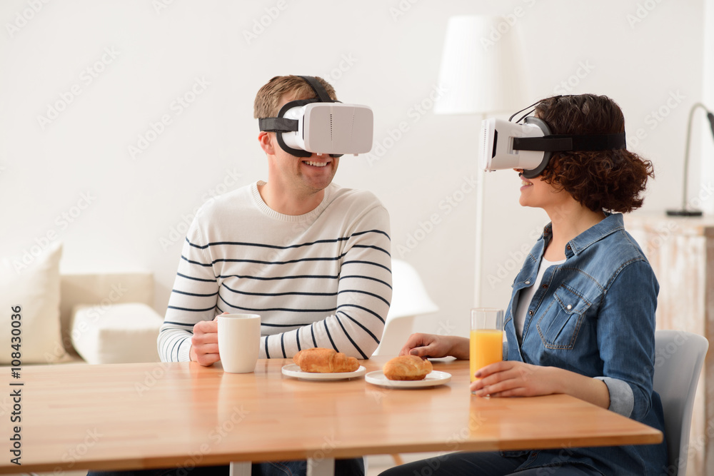 Positive couple sitting at the table Positive couple sitting at the table