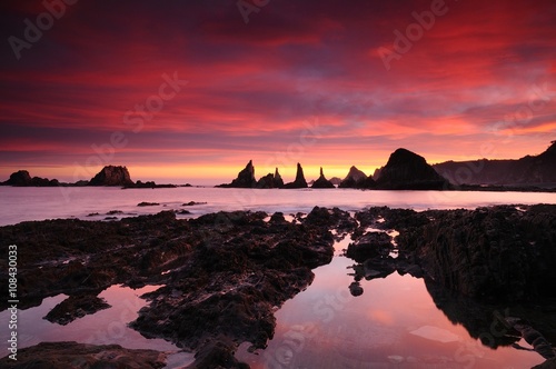 Beautiful sunrise in rocky waterscape photo