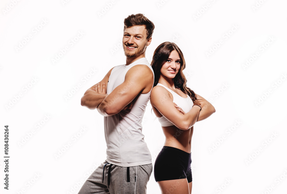 Athletic couple over white background Athletic couple over white background