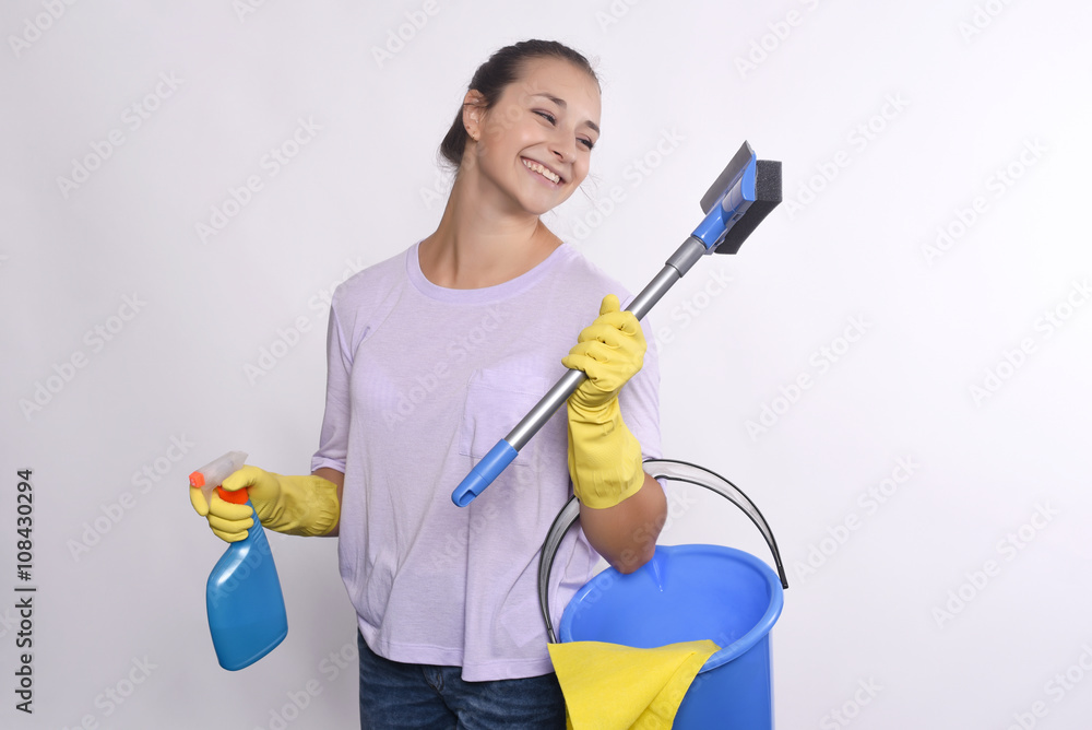 young housewife holding cleaning products. young housewife holding cleaning products.