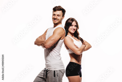 Athletic couple over white background