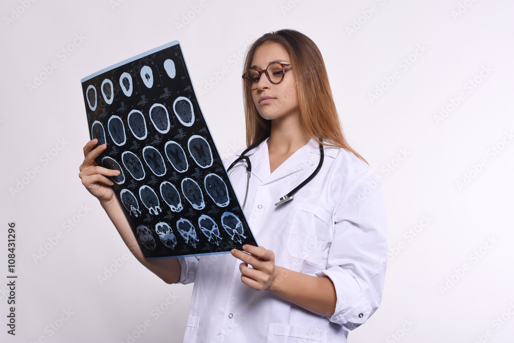 woman doctor with MRI scans. Isolated white background woman doctor with MRI scans. Isolated white background
