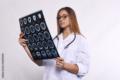 woman doctor with MRI scans. Isolated white background