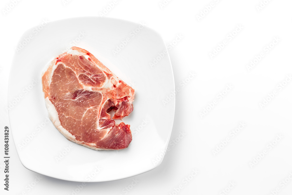 Pork chops on white plate