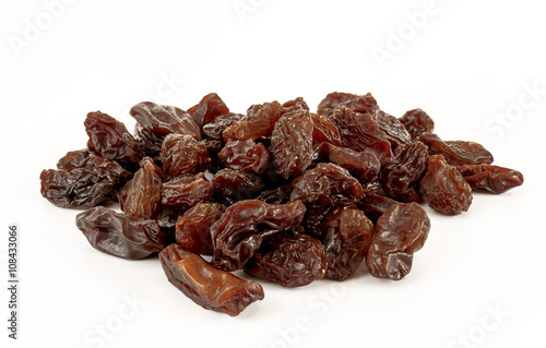 Raisins in white background.