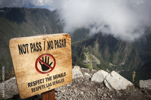 A 'Do Not Pass' warning sign at the top of Montana, Machu Picchu, Peru