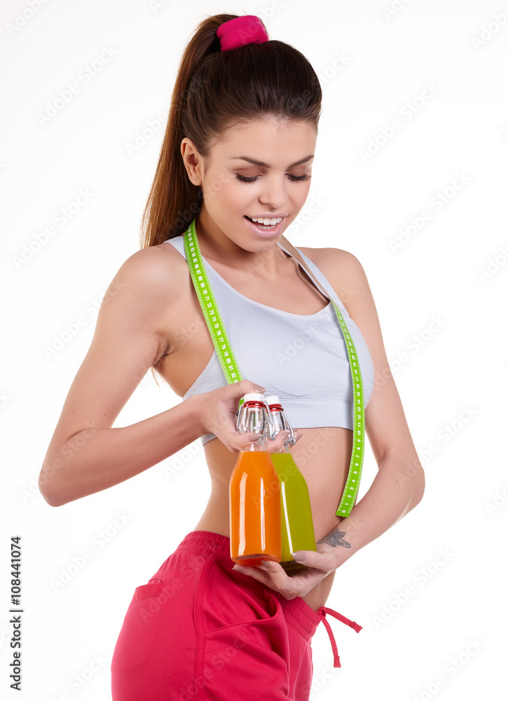 Slim Young Woman with perfect healthy fitness body with a tape m Slim Young Woman with perfect healthy fitness body with a tape m