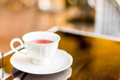 Cherry tea on table, soft focus