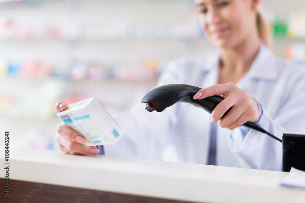 Fototapeta premium Pharmacist scanning product