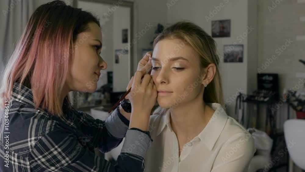 Attractive business woman in a beauty salon. Professional Stylist making make-up day. Nice atmosphere, Attractive business woman in a beauty salon. Professional Stylist making make-up day. Nice atmosphere,