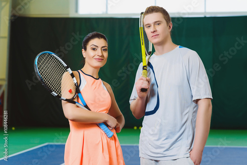 Two Happy smiling Tennis Players posing indoor © dreamsnavigator