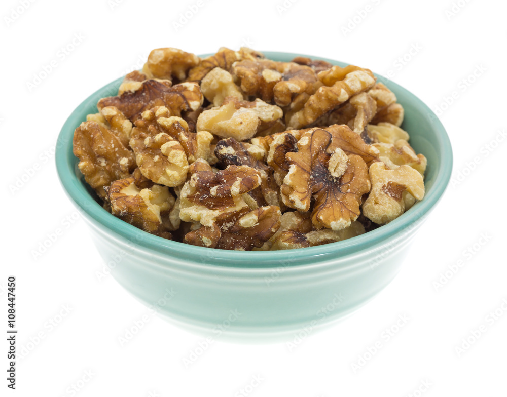 Bowl filled with shelled walnuts on a white background Bowl filled with shelled walnuts on a white background