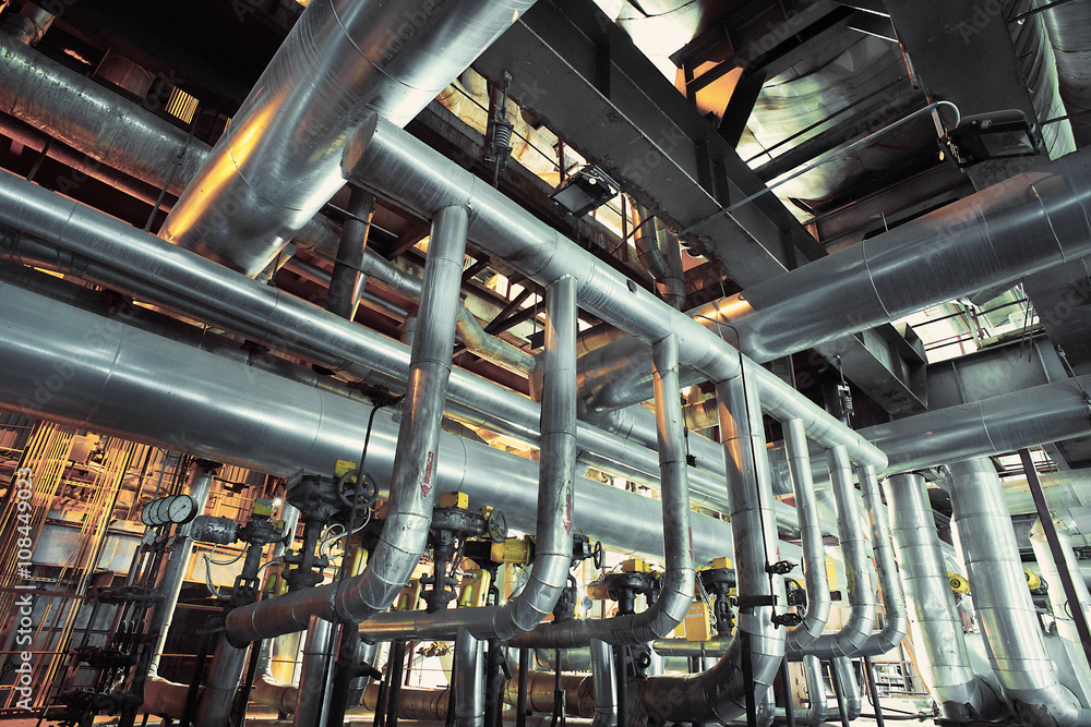 Equipment, cables and piping as found inside of a modern industr Equipment, cables and piping as found inside of a modern industr