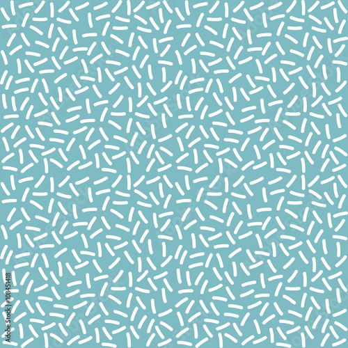 Seamless background with blue glaze and many white sprinkles.