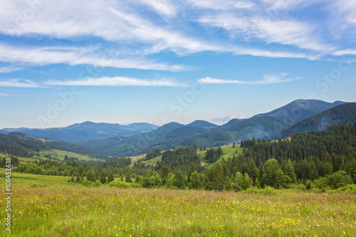 Summer landscape in mountains and the dark blue sky with clouds © Ryzhkov Oleksandr
