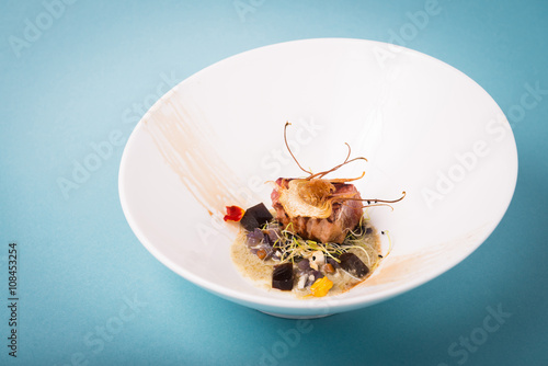 Haute cuisine presentation of tuna with artichoke.