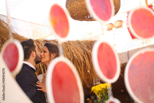 bride and groom kissing photo