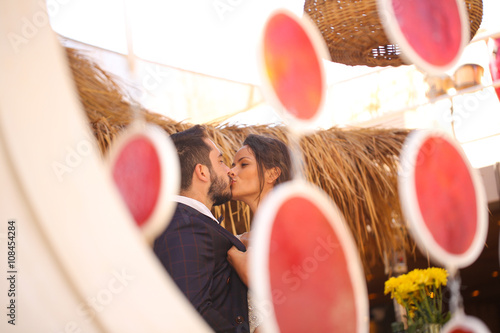 bride and groom kissing photo