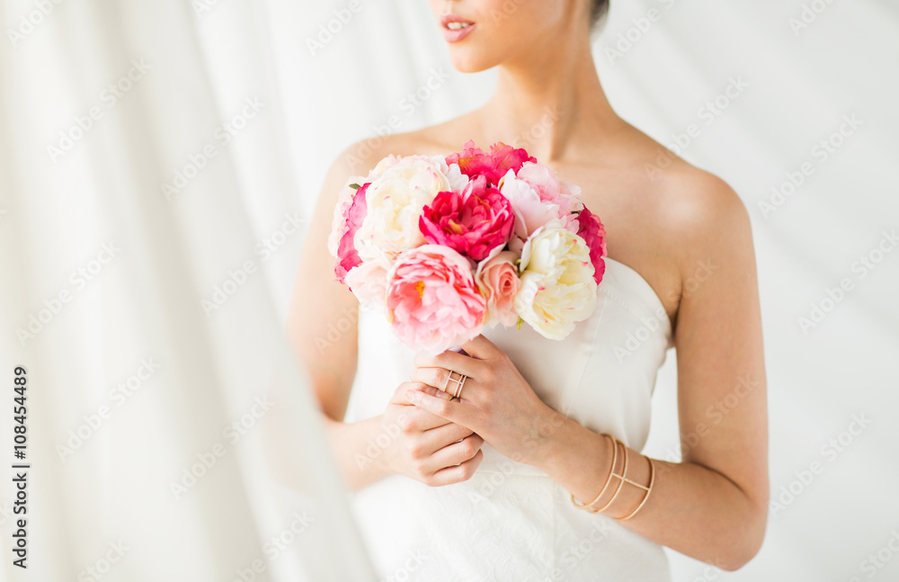 close up of woman or bride with flower bouquet
