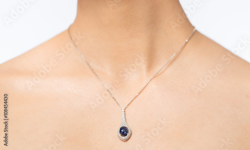 close up of beautiful woman neck with pendant