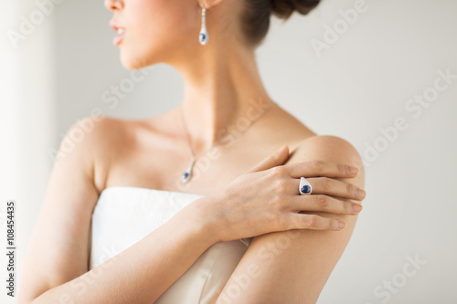 close up of beautiful woman with finger ring