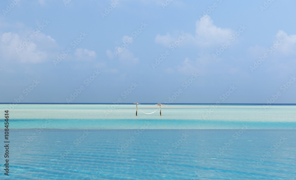 hammock in water on maldives beach