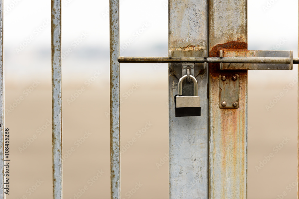 Close up of locked gate Close up of locked gate