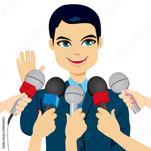 Male politician or businessman answering press questions in front of journalists holding microphones