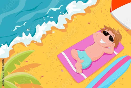 boy lying on the beach wearing sunglasses