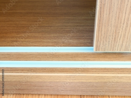 Close up of slide wooden door and rail