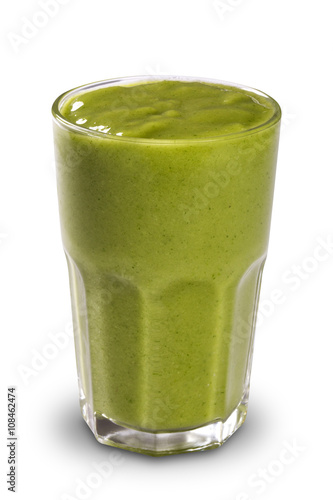 Green smoothie in a glass with straws isolated on a white backgr