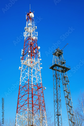 Two high towers with transmitting antennas.