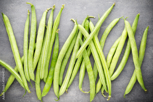 Green beans  on a gray background.