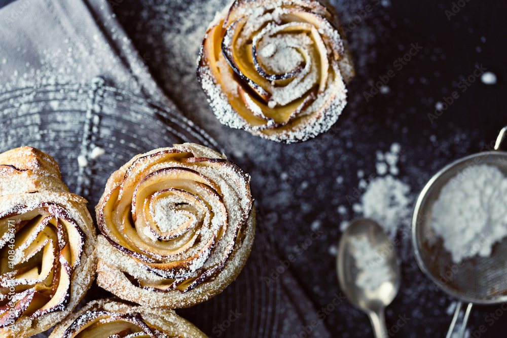 mini apple roses puff pastry with icing sugar. mini apple roses puff pastry with icing sugar.