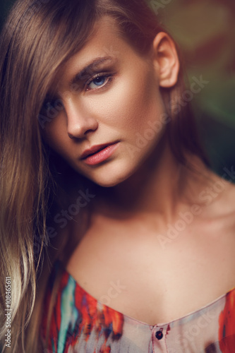 Portrait of a young and beautiful girl in the forest