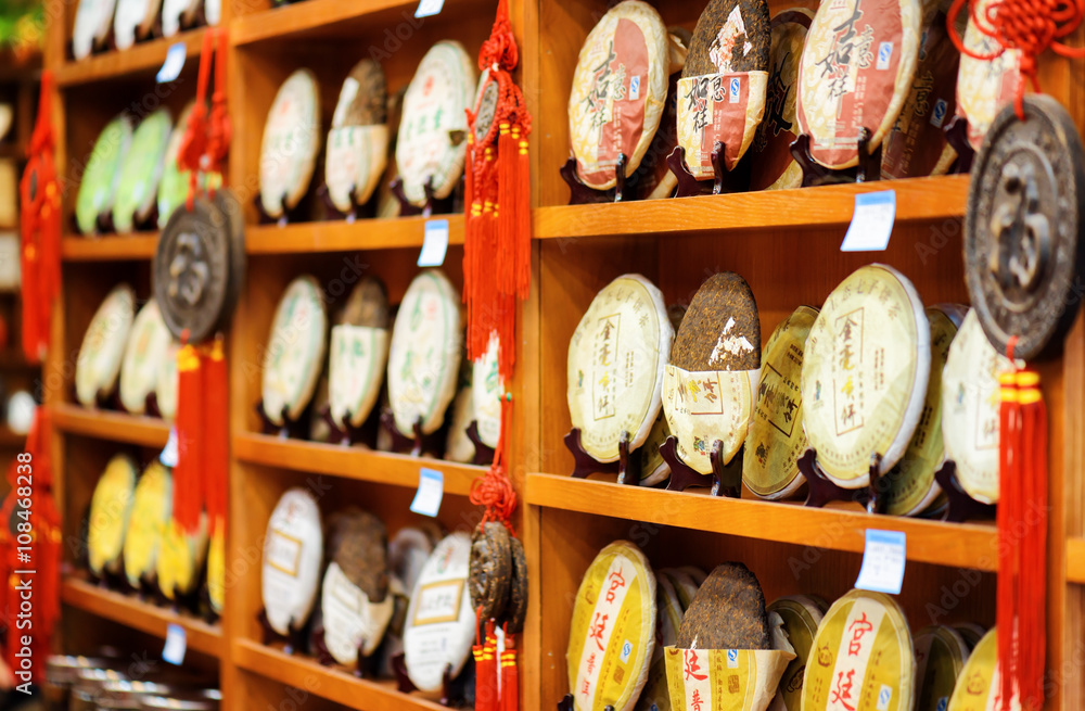 Fototapeta premium Disks of post-fermented tea Yunnan Puer, the Old Town of Lijiang
