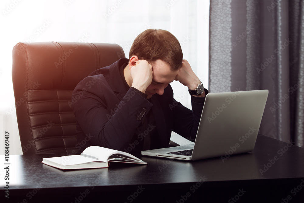 Businessman is tired and can not work anymore Businessman is tired and can not work anymore