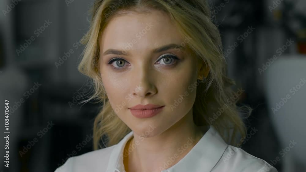 Beautiful blonde with make-up and hairstyle, looking into the camera. Beautiful blonde with make-up and hairstyle, looking into the camera.