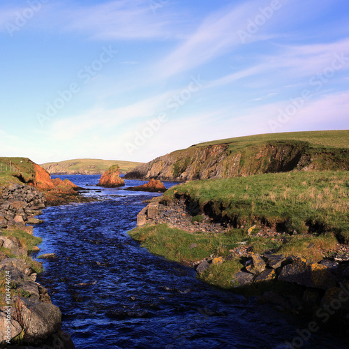 The river flowing out of Loch Spiggie, south Mainland, Shetland, Scotland, UK. photo