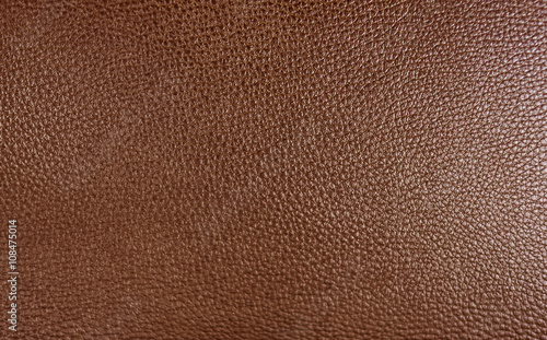 Brown color leatherette texture as background.