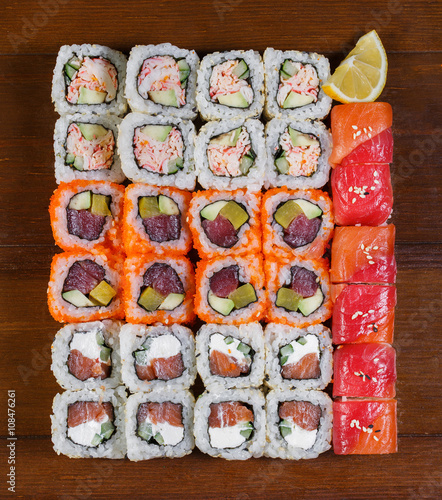Japanese food. Assorted sushi on a wooden table, top view