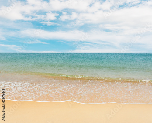 Blue sea with white sand beach on blue sky © jimbophotoart