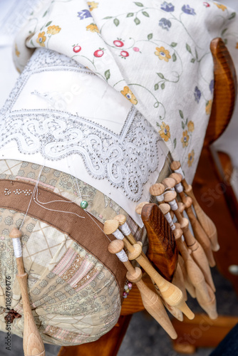 Bobbin Lace Hands at Work / Bobbin Lace with embroidery seen from above.