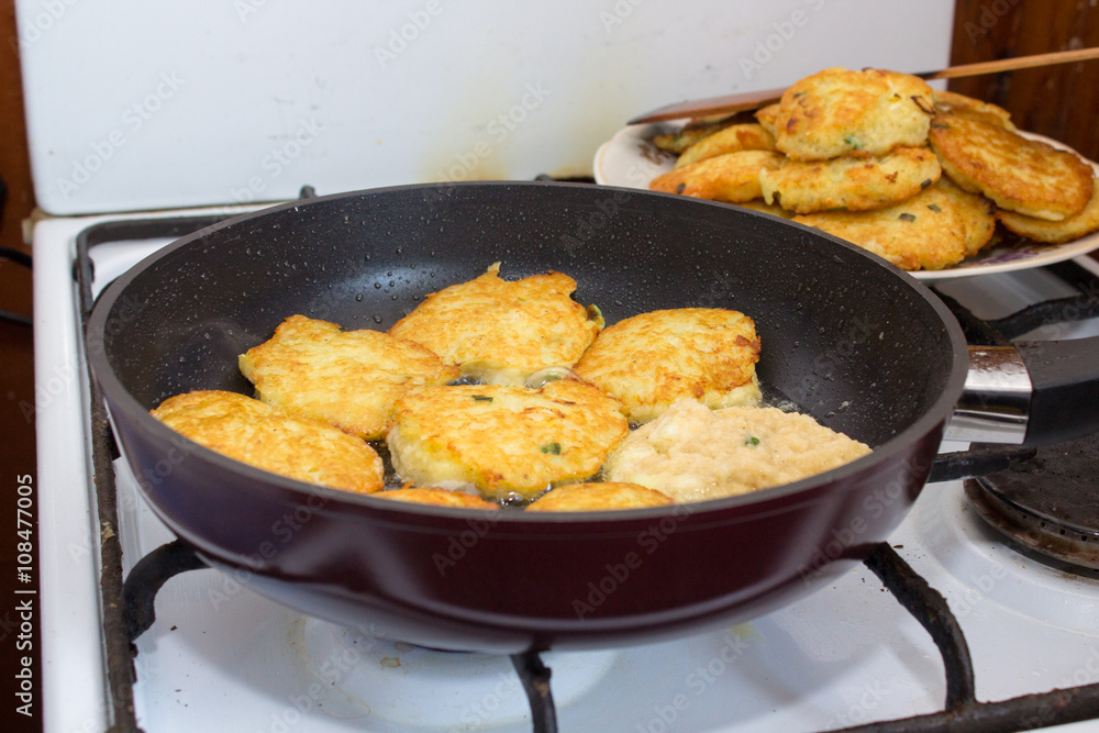 Potato pancake in a frying pan Potato pancake in a frying pan