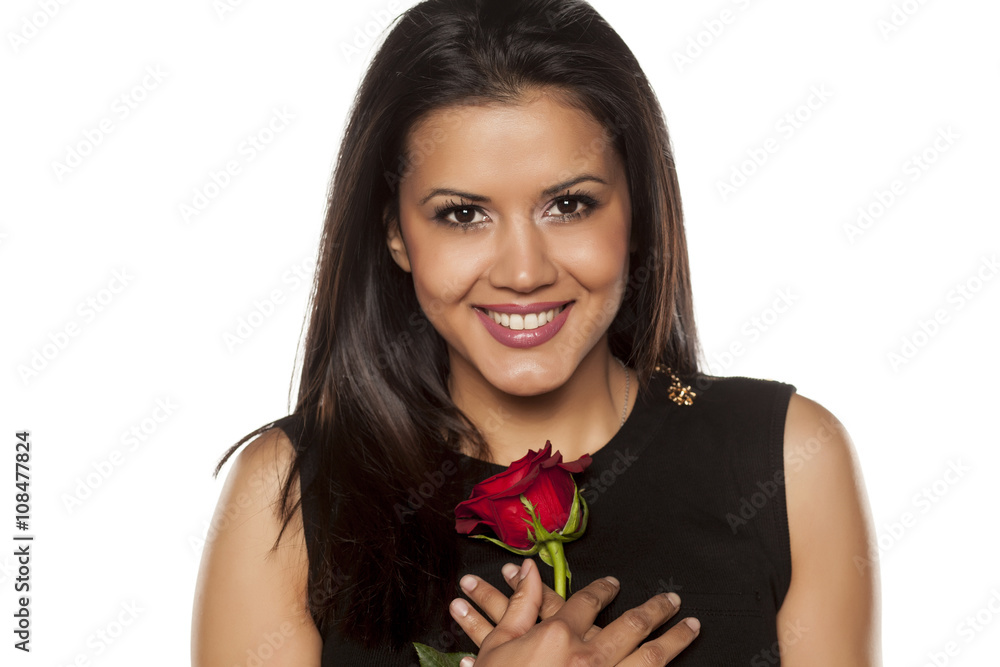 happy beautiful young woman holding a red rose happy beautiful young woman holding a red rose