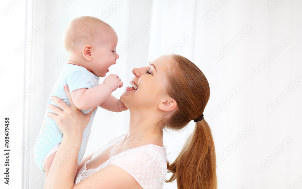 happy family mother playing with baby happy family mother playing with baby