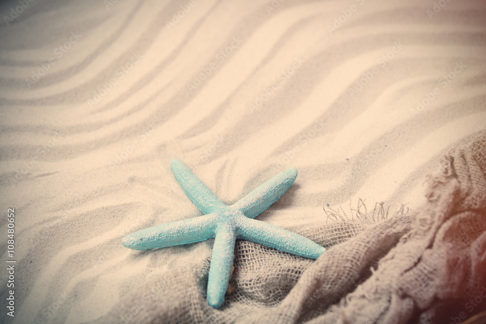 starfish and fishnet on the sand starfish and fishnet on the sand